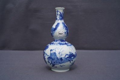 A Chinese blue and white double gourd vase, Transitional period